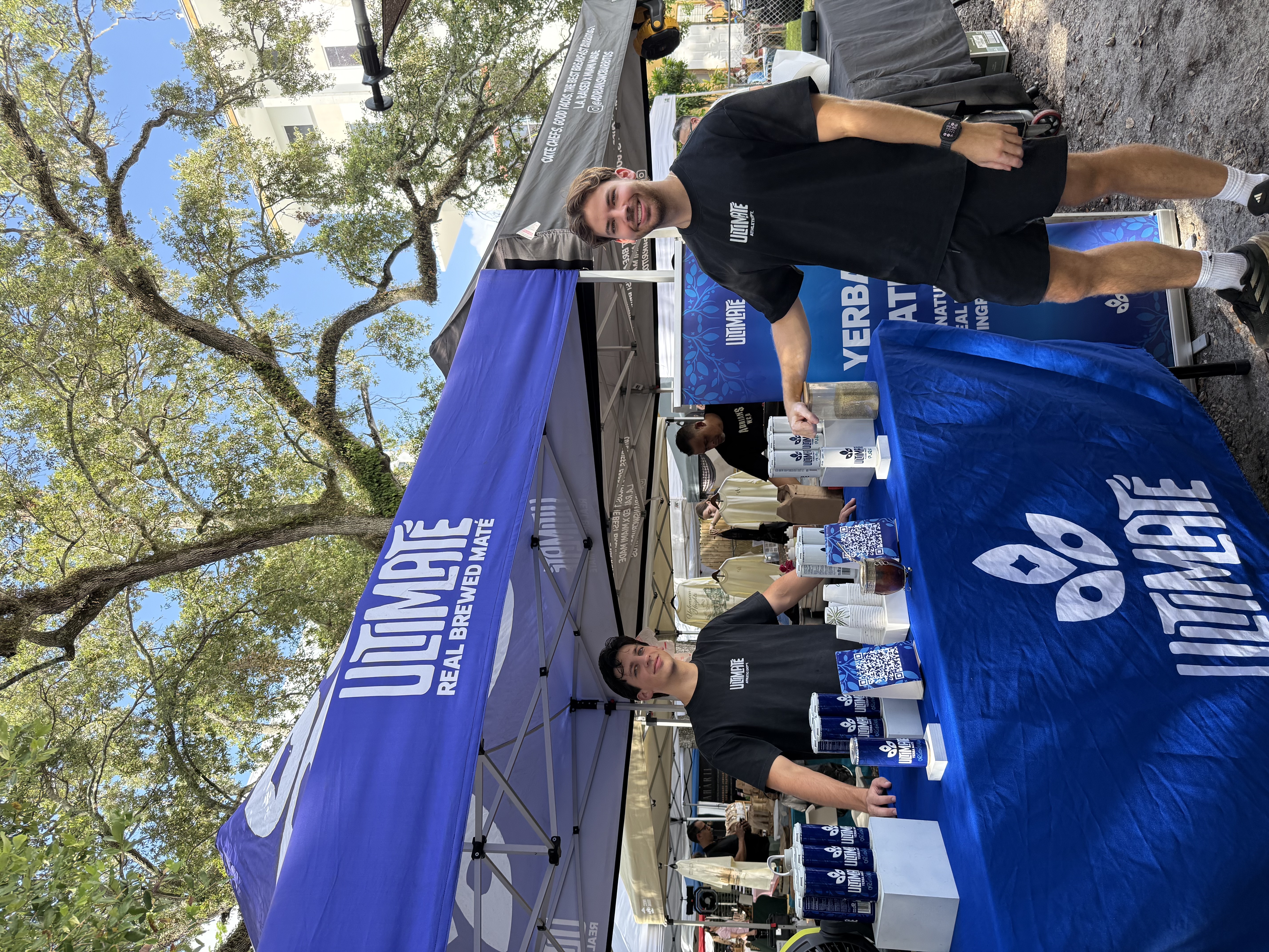 The ULTIMATÉ founders serving customers at their booth
